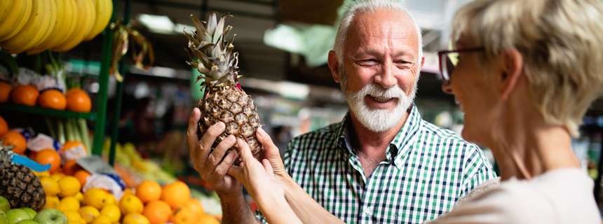 Women looking at a pineapple